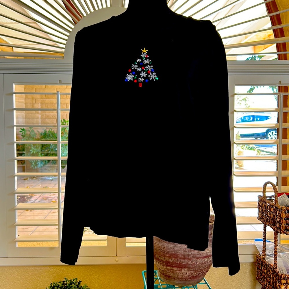 Black long sleeved tee.  Features a bright Christmas tree in front.  Size XL